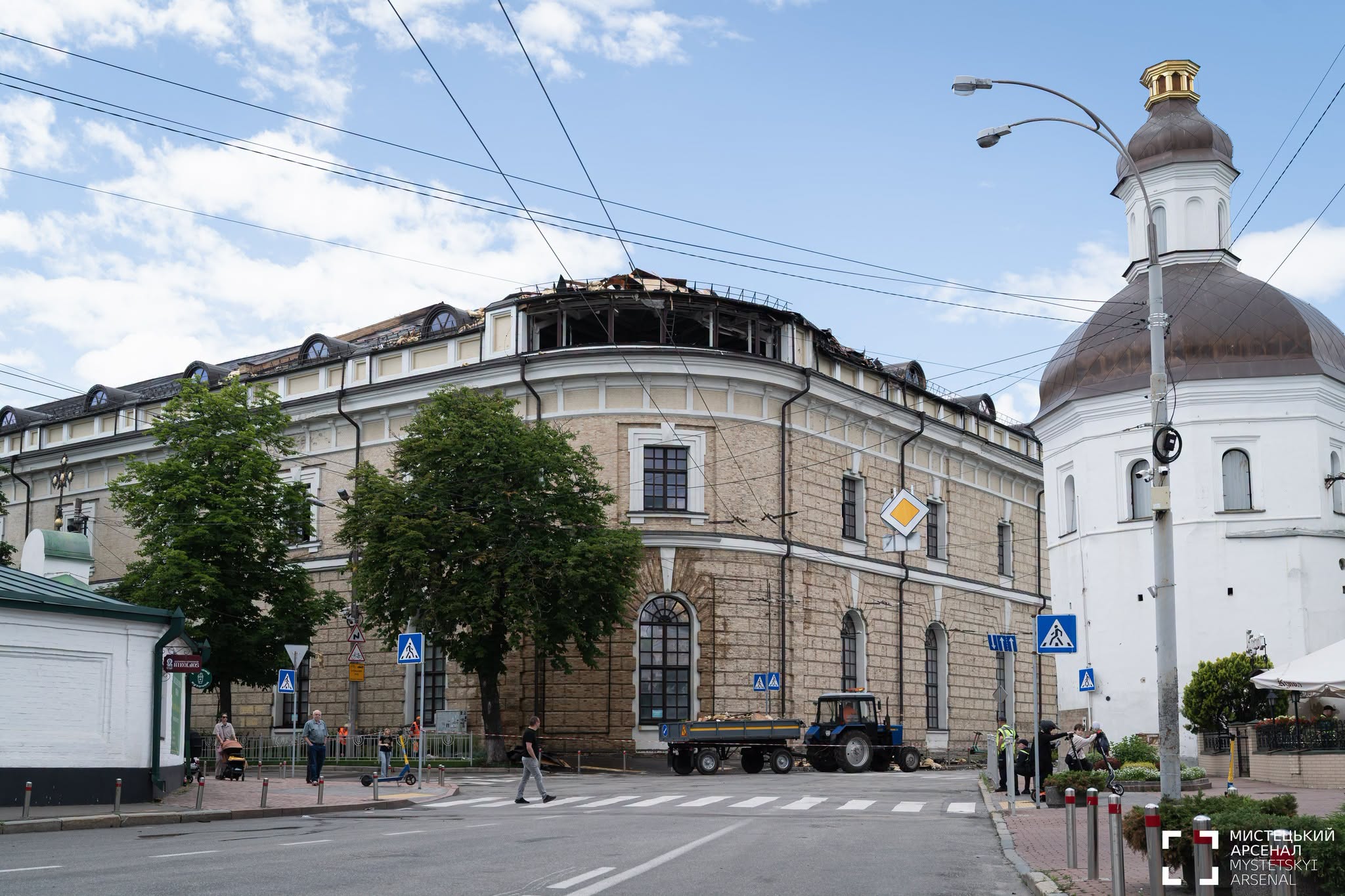 Street-level daytime view of the Mystetskyi Arsenal in Kyiv, its roof damaged and partly collapsed after the Russian attack of 15 June 2026.